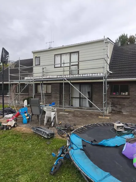 Second-storey deck before, on scaffolding