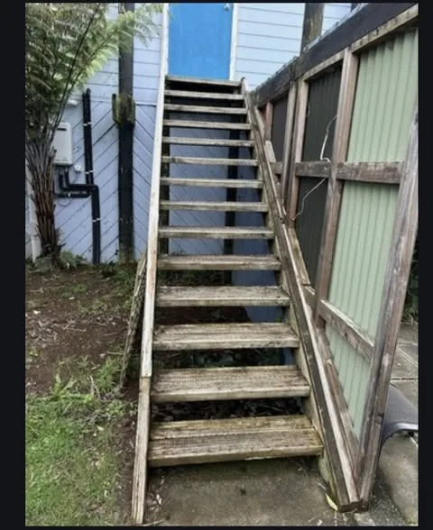 Old weathered timber stairs before replacement